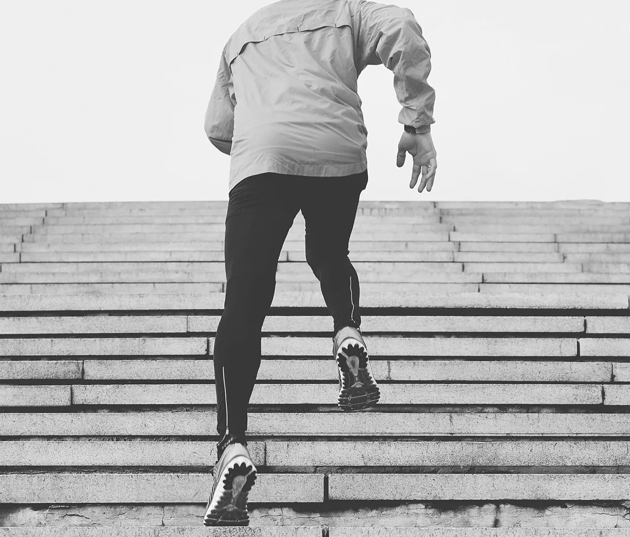 Person running up outdoor stairs